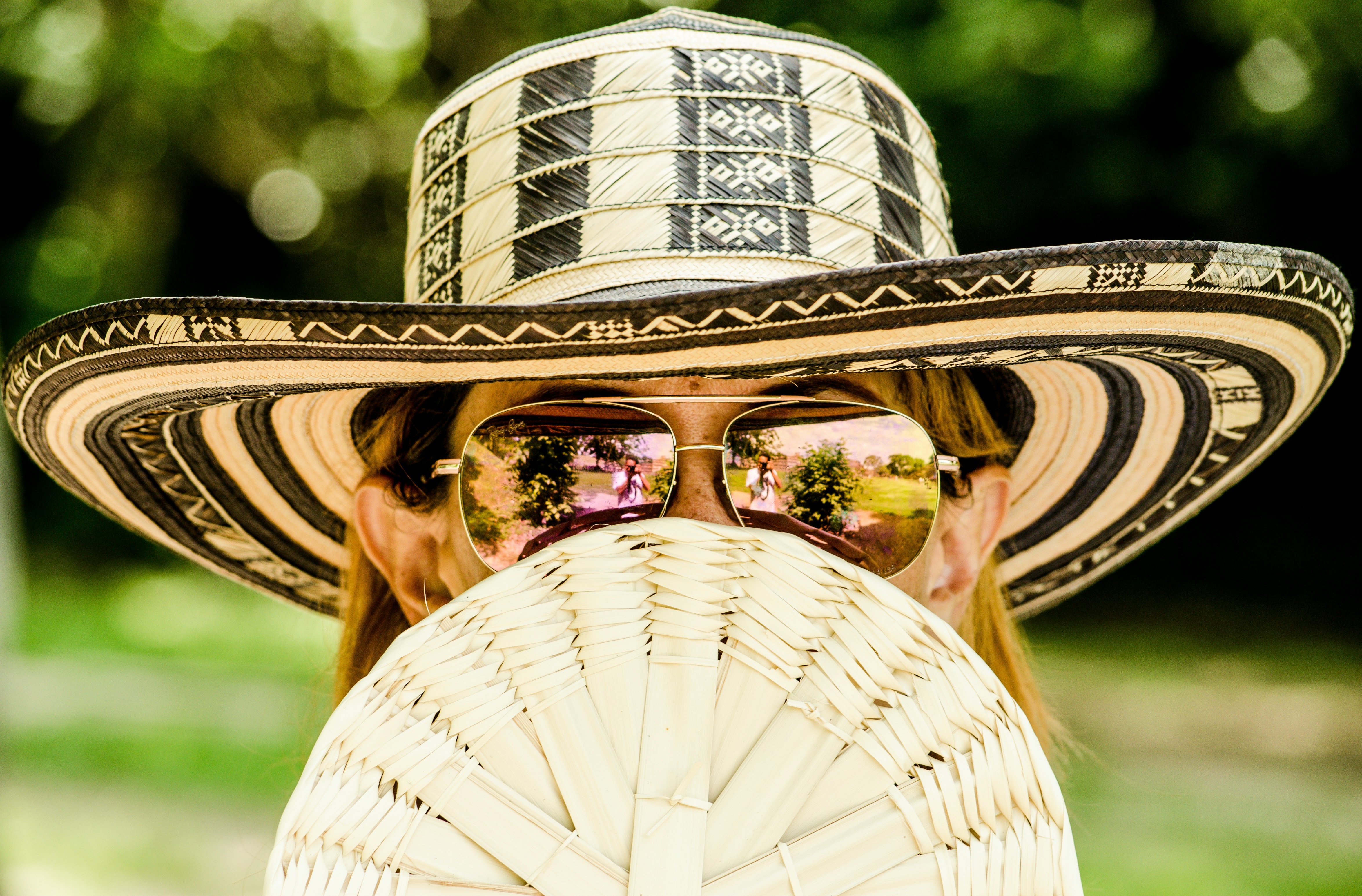 selective focus photo of woman wearing aviator sunglasses